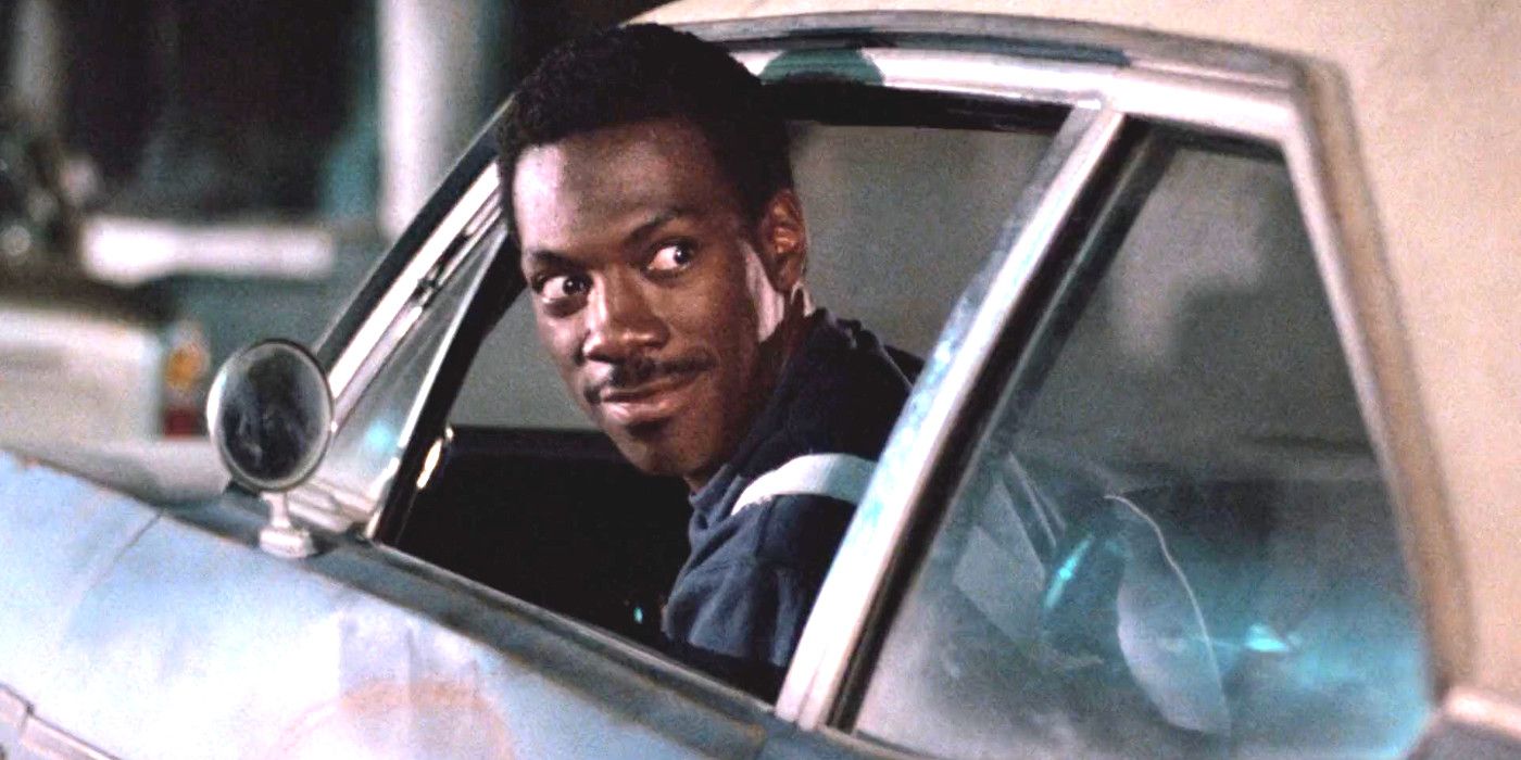 Eddie Murphy as Axel Foley in Beverly Hills Cop making a funny face while driving a car