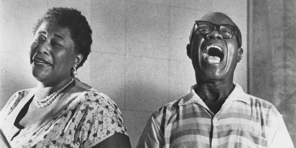 Ella Fitzgerald and Louis Armstrong singing together.