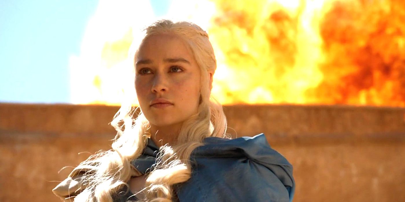Daenerys in Game of Thrones looking fierce while standing in front of a giant explosion