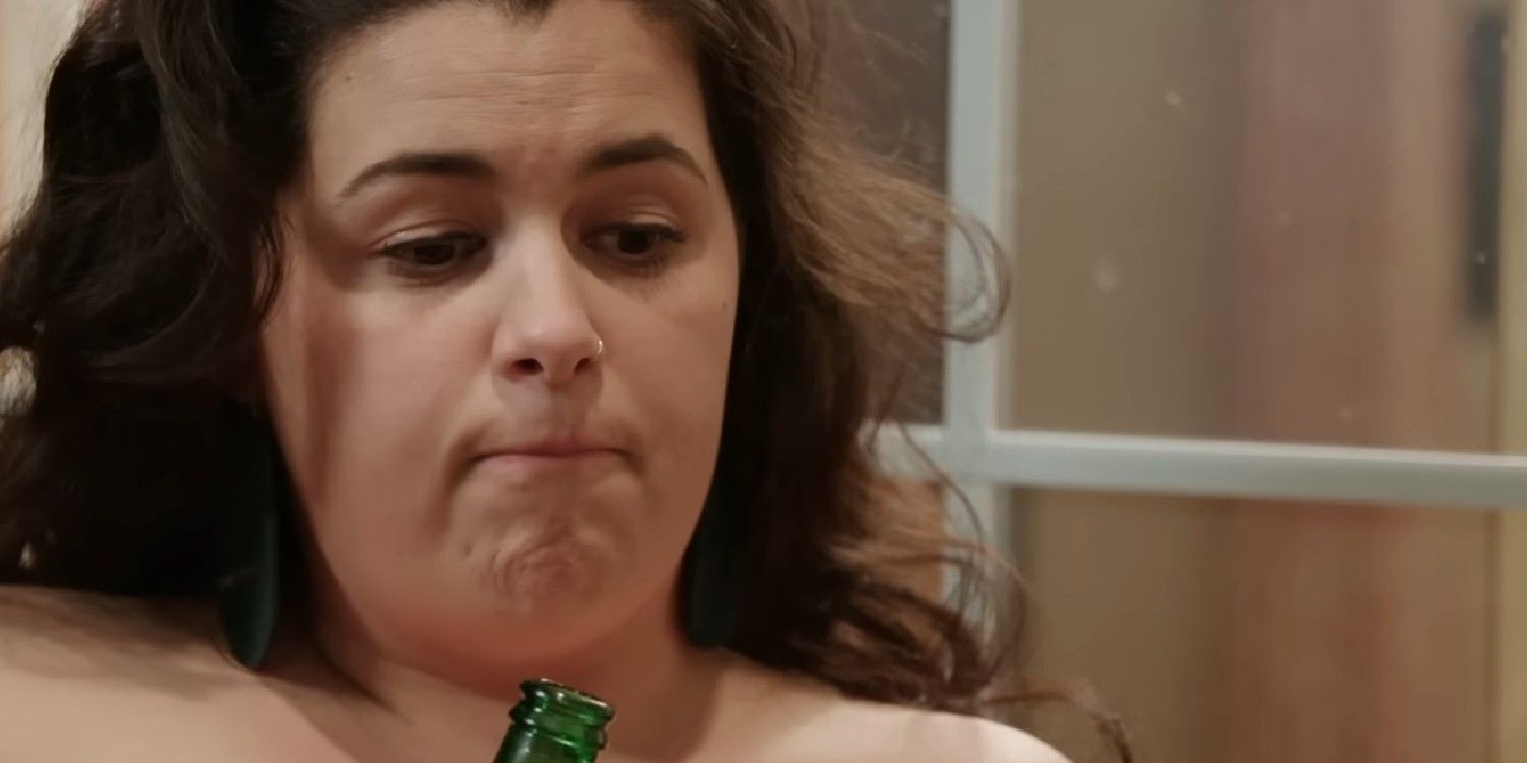 Emily Bieberly Drinking Alcohol In 90 Day Fiancé with a grumpy expression on her face during her wedding with Kobe Blaise