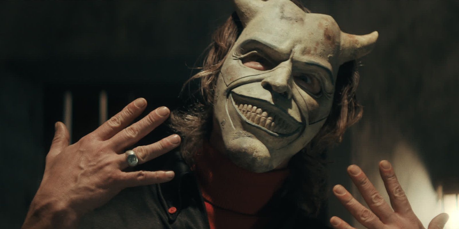 Ethan Hawke wearing a mask as The Grabber in The Black Phone