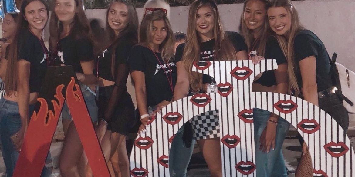 Cropped Holding Greek Letters with Her Sorority Sisters
