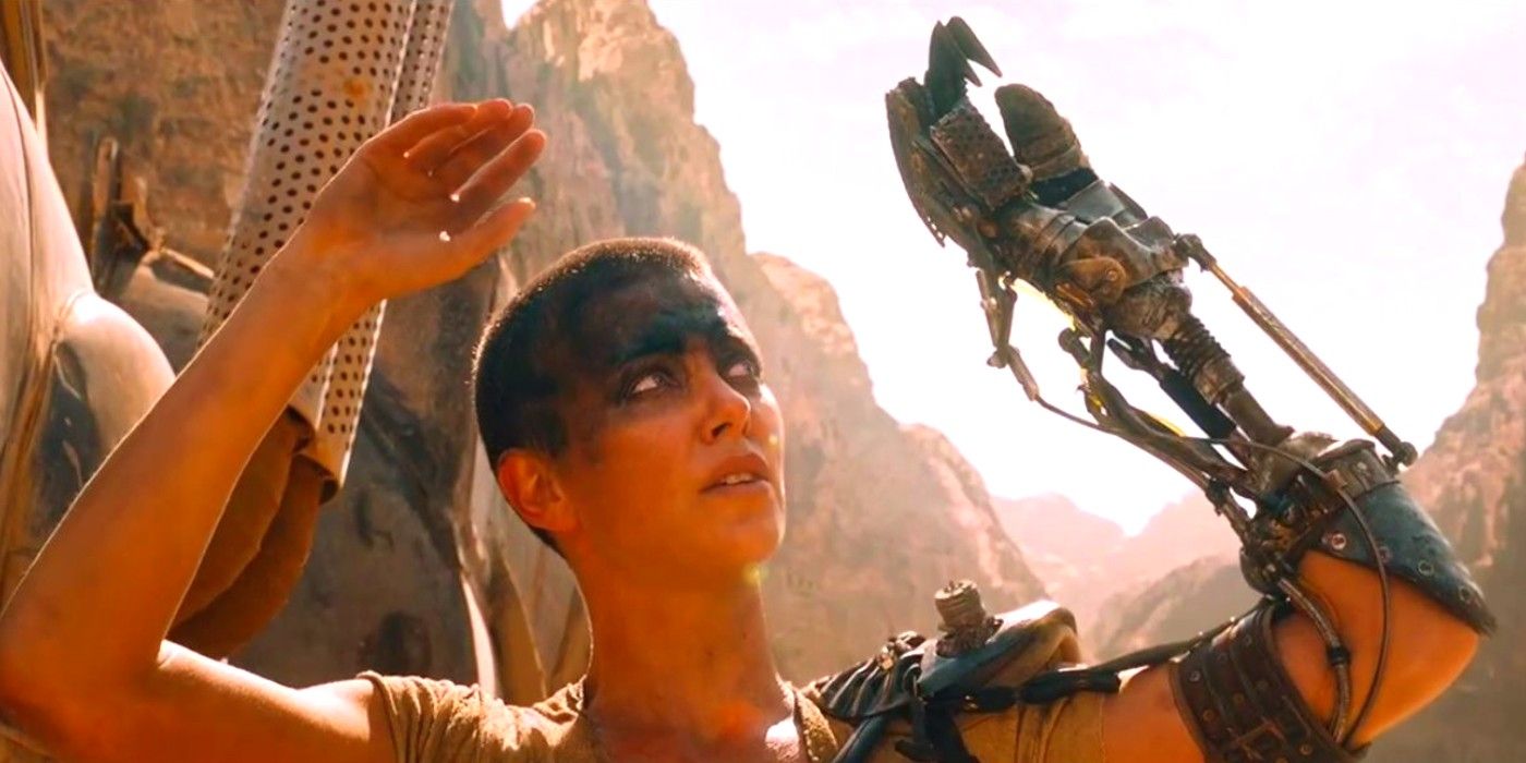 Furiosa with her hands up in Mad Max Fury Road