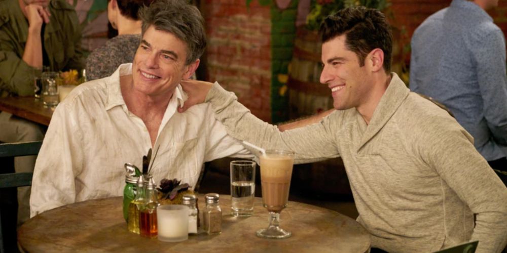 Gavin with Schmidt sitting at a table with drinks on New Girl