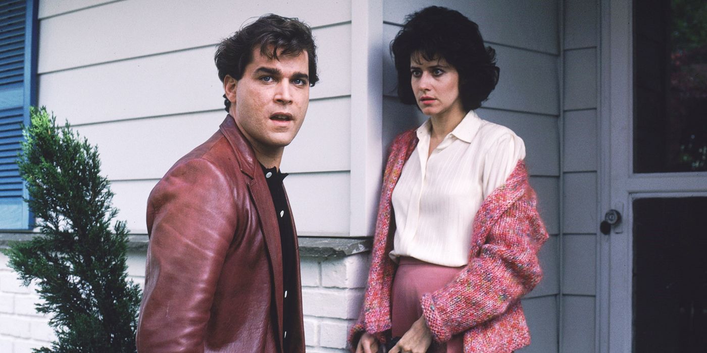Henry Hill standing in front of a house with Karen in Goodfellas