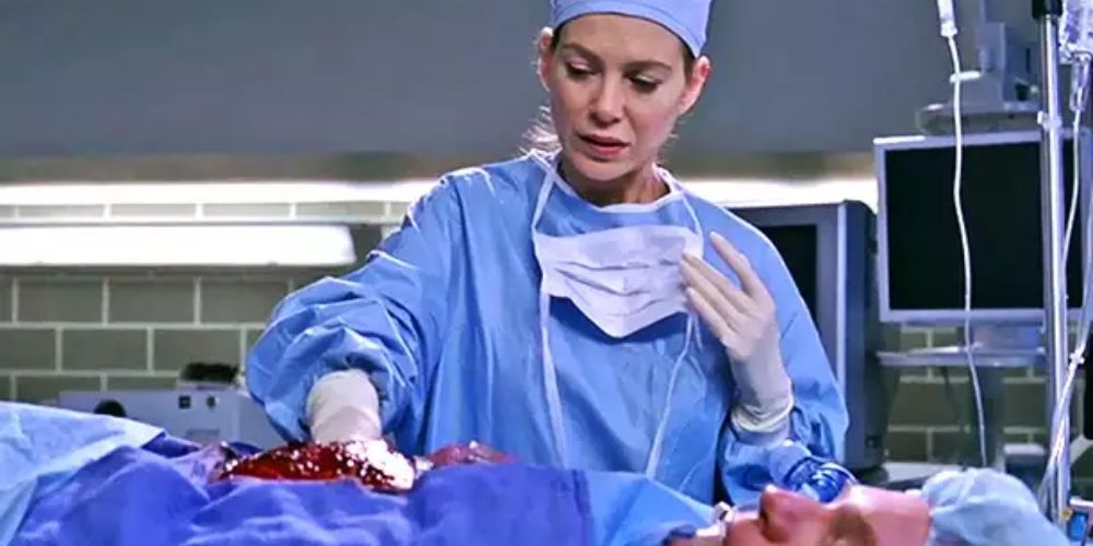 Meredith with her hand inside a patient in Grey&rsquo;s Anatomy
