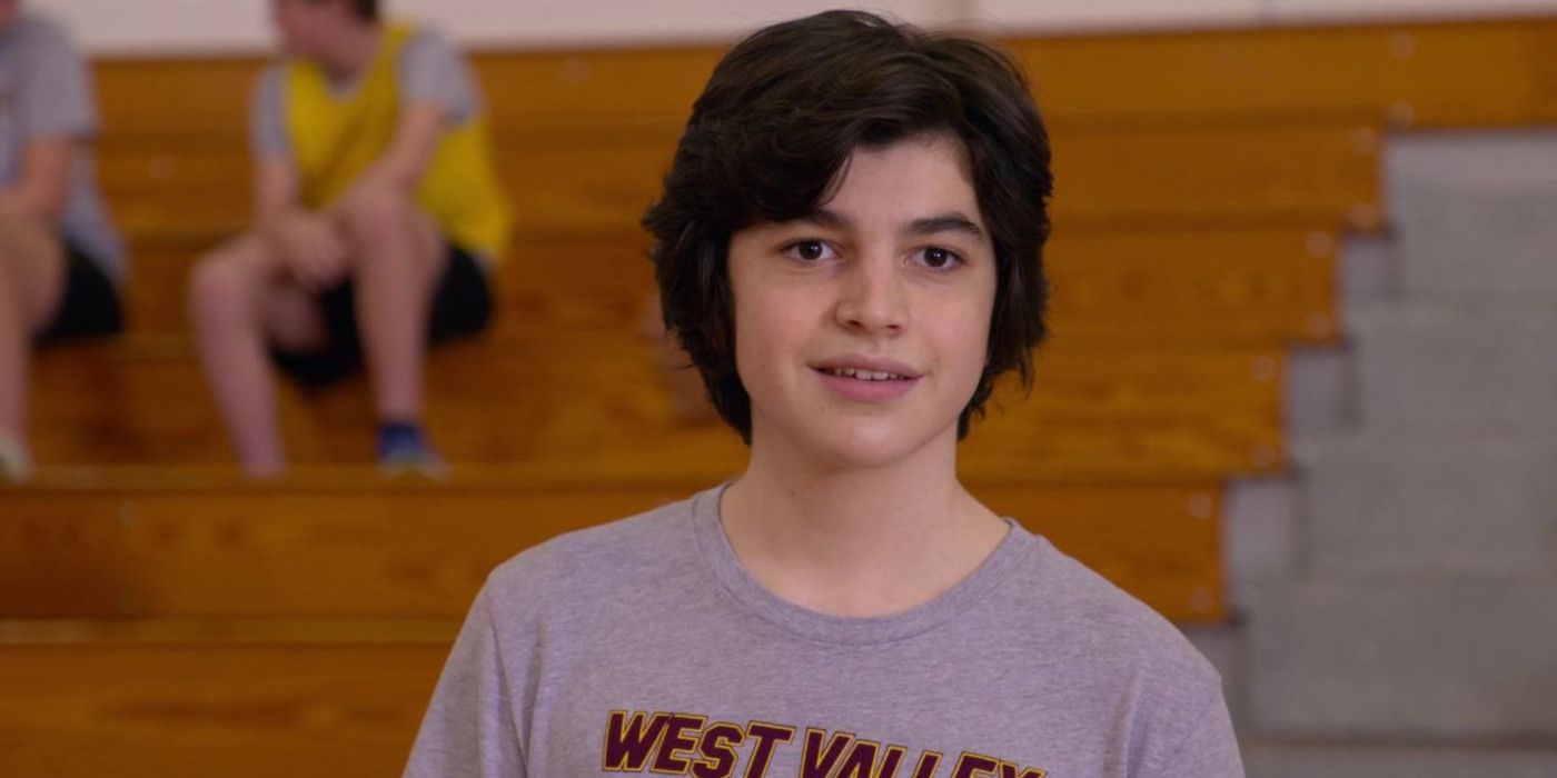 Griffin Santopietro as Anthony LaRusso in Cobra Kai season 4 in a gymnasium in a gray t-shirt 