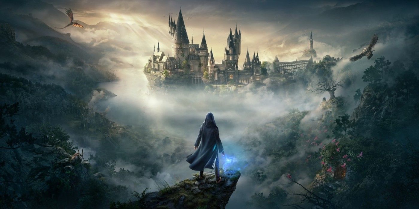 Promotional artwork for Hogwarts Legacy, depicting a robed figure holding a wand on a rocky outcropping in the foreground. The background shows Hogwarts castle and the surrounding area, with a dragon and owl flying through the air.