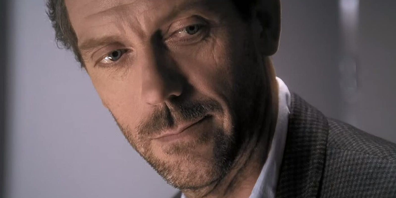 Hugh Laurie as Dr House smirking