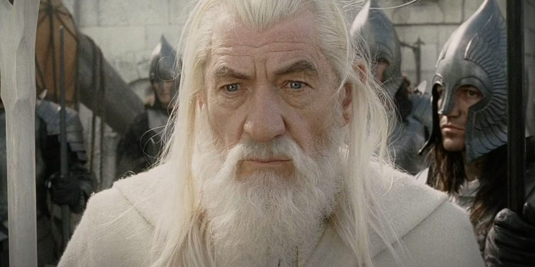 Gandalf the White standing in front of soldiers in The Lord of the Rings.