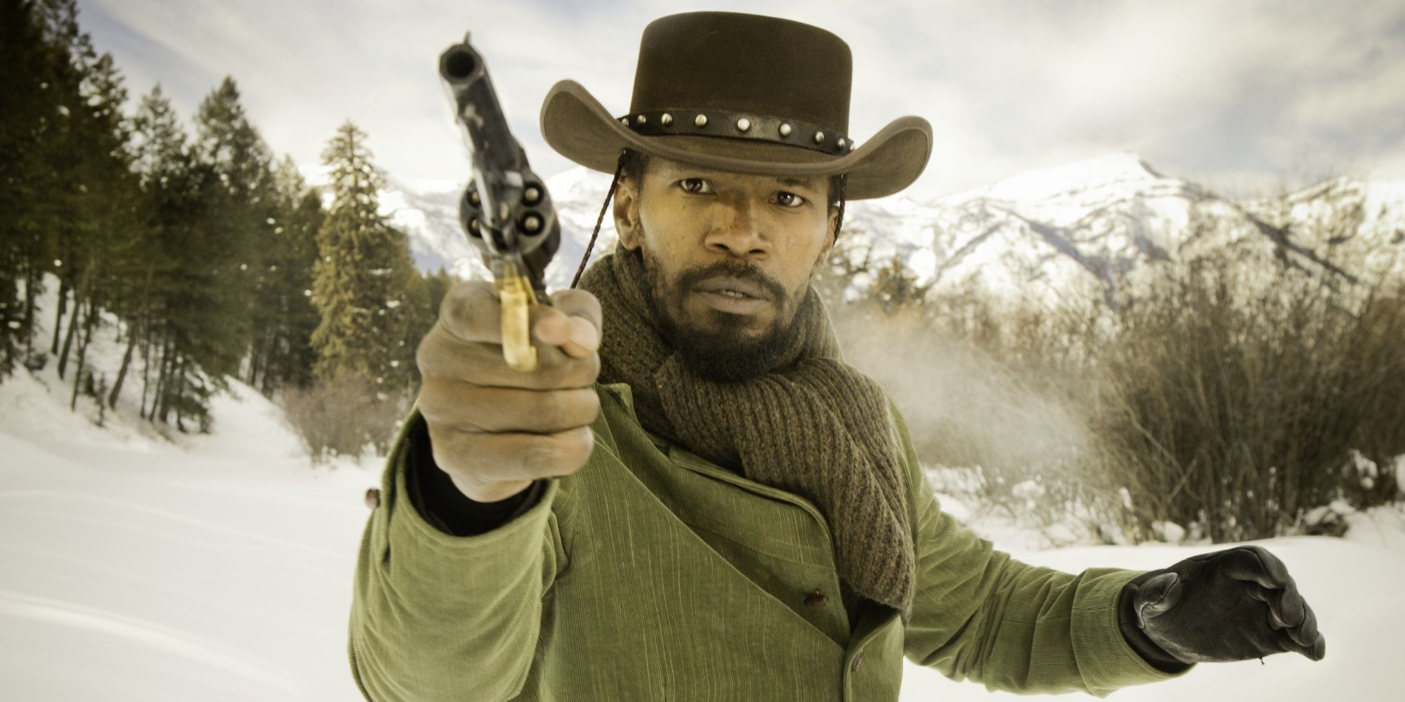 Jamie Foxx with a gun in the snow in Django Unchained