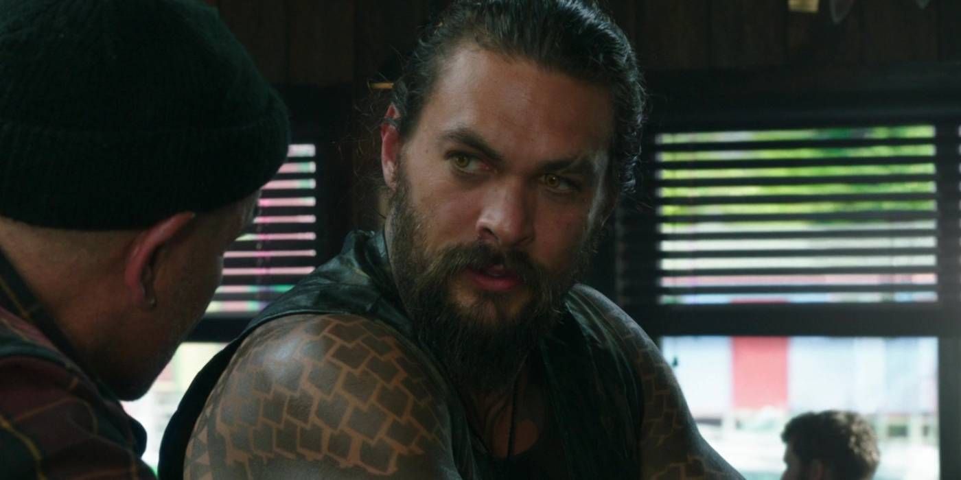 An image of Aquaman talking to his father in the movie