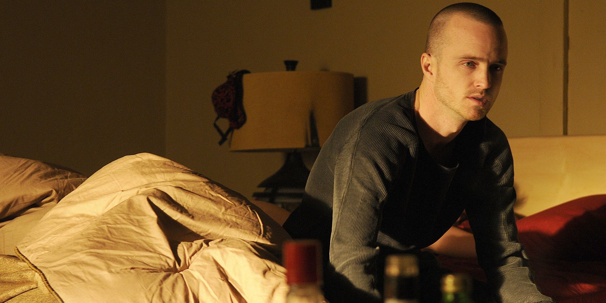 Jesse Pinkman sitting on the bed in Breaking Bad 