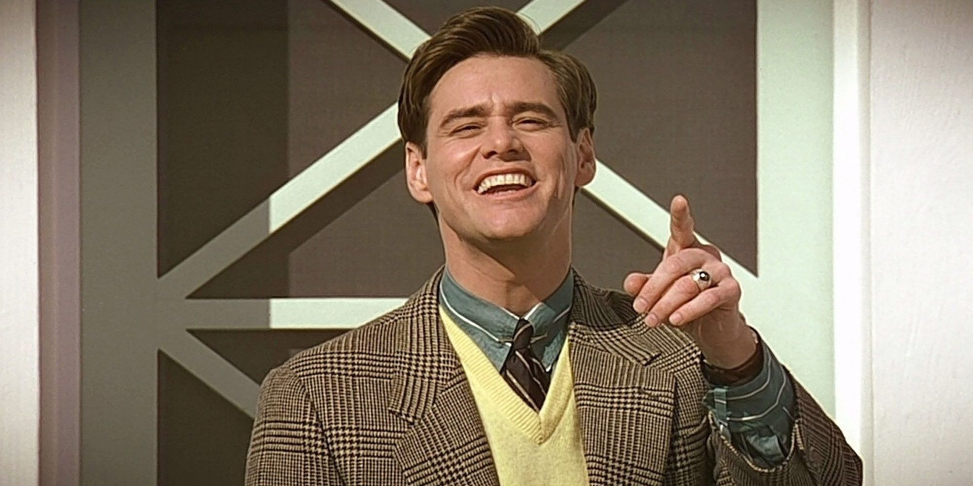 Jim Carrey pointing a finger in The Truman Show