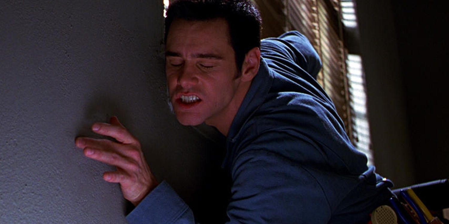 Jim Carrey up against a wall in The Cable Guy
