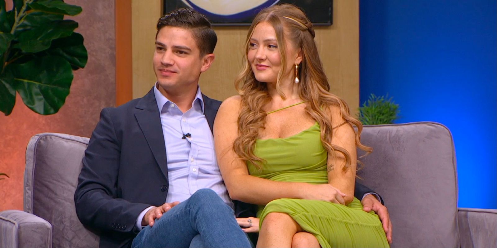 Kara Bass and Guillermo Rojer at the 90 Day Fiancé Season 9 Tell All smiling and holding each other