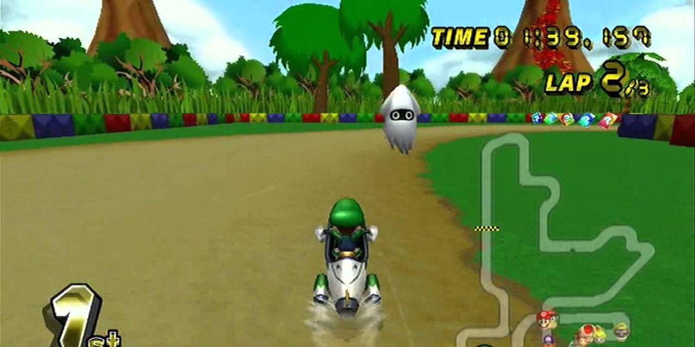 Luigi driving in Lakeside Park in Mario Kart