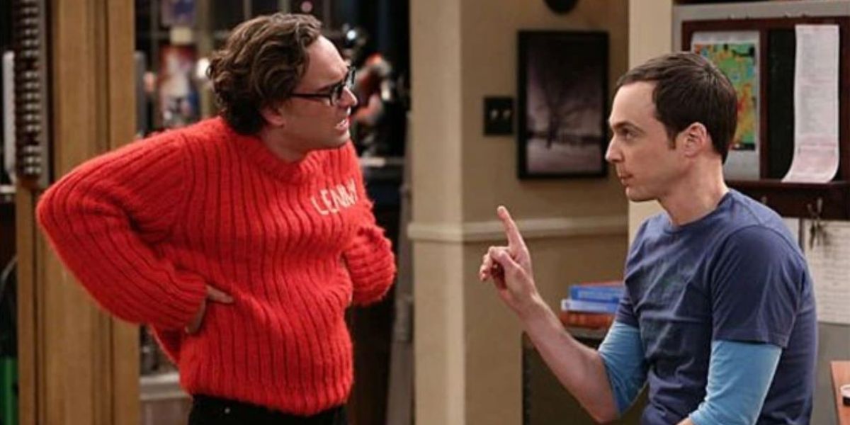 Leonard wearing the itchy red sweater and looking frustrated as he talks to Sheldon in TBBT