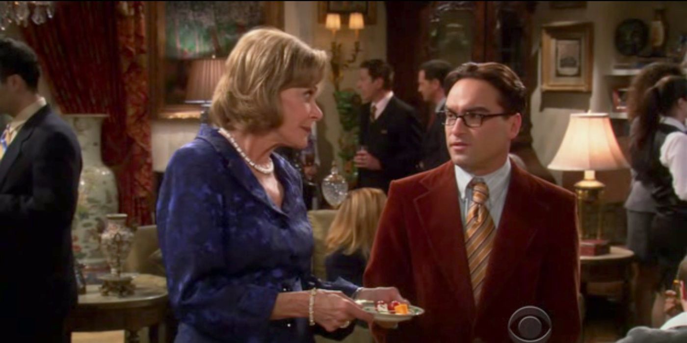 Leonard talks to a donor at a work event on TBBT