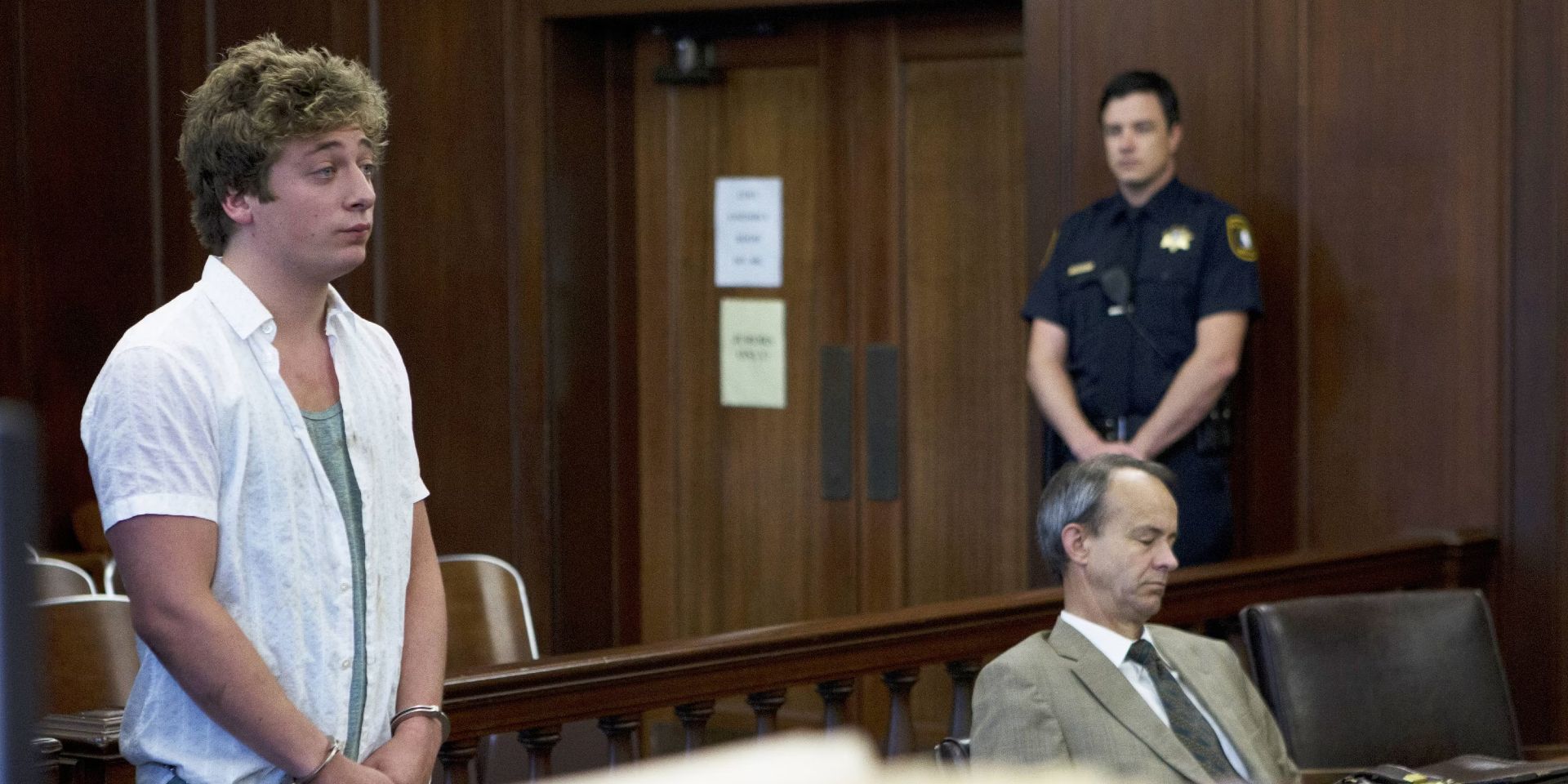 Lip standing up in court with handcuffs in Shameless