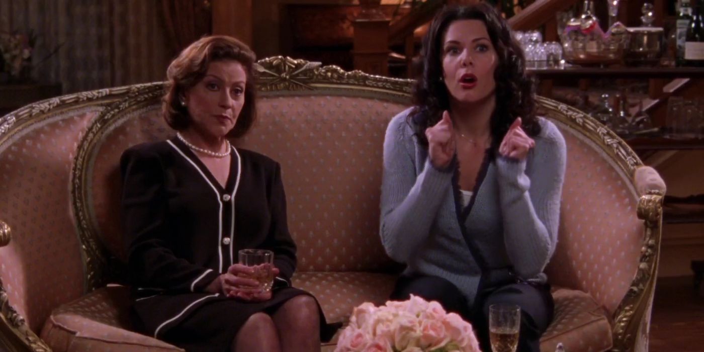 Lorelai and Emily sit on a couch on Gilmore Girls