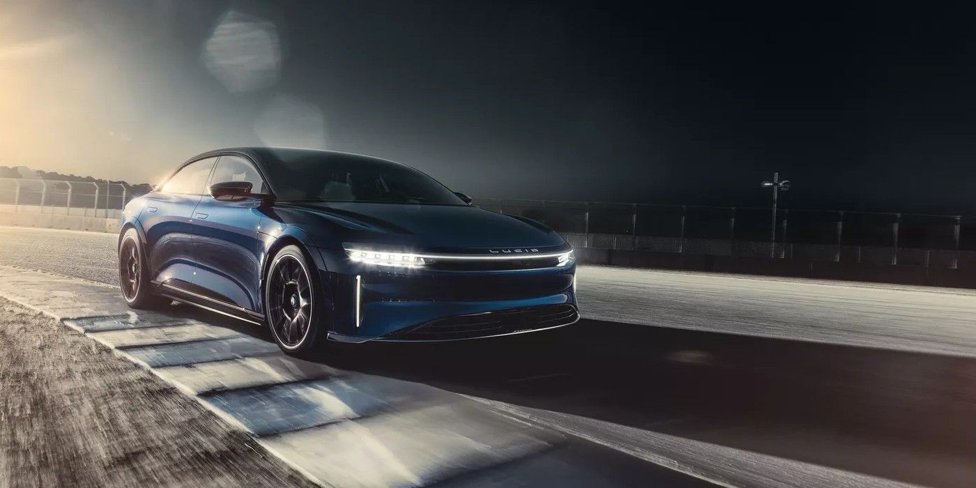 The Lucid Air Sapphire night going down a road.
