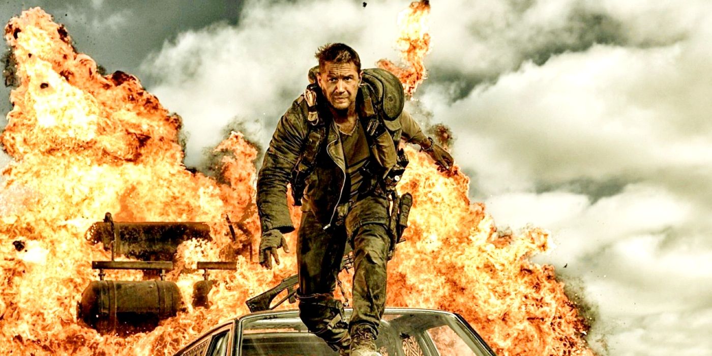 Tom Hardy as Max Rockatansky flees a burning car in Mad Max: Fury Road.