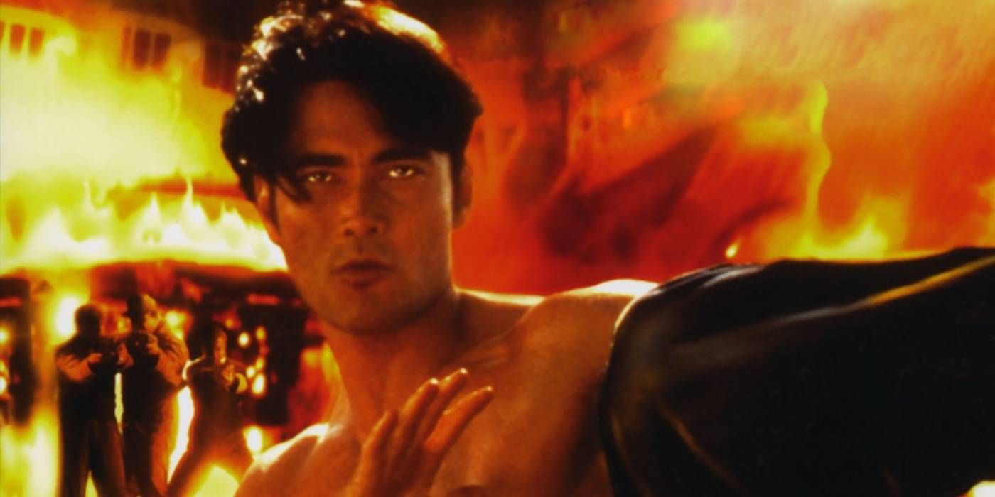 Mark Dacascos with flames behind him in Redemption Kickboxer 5 poster pic