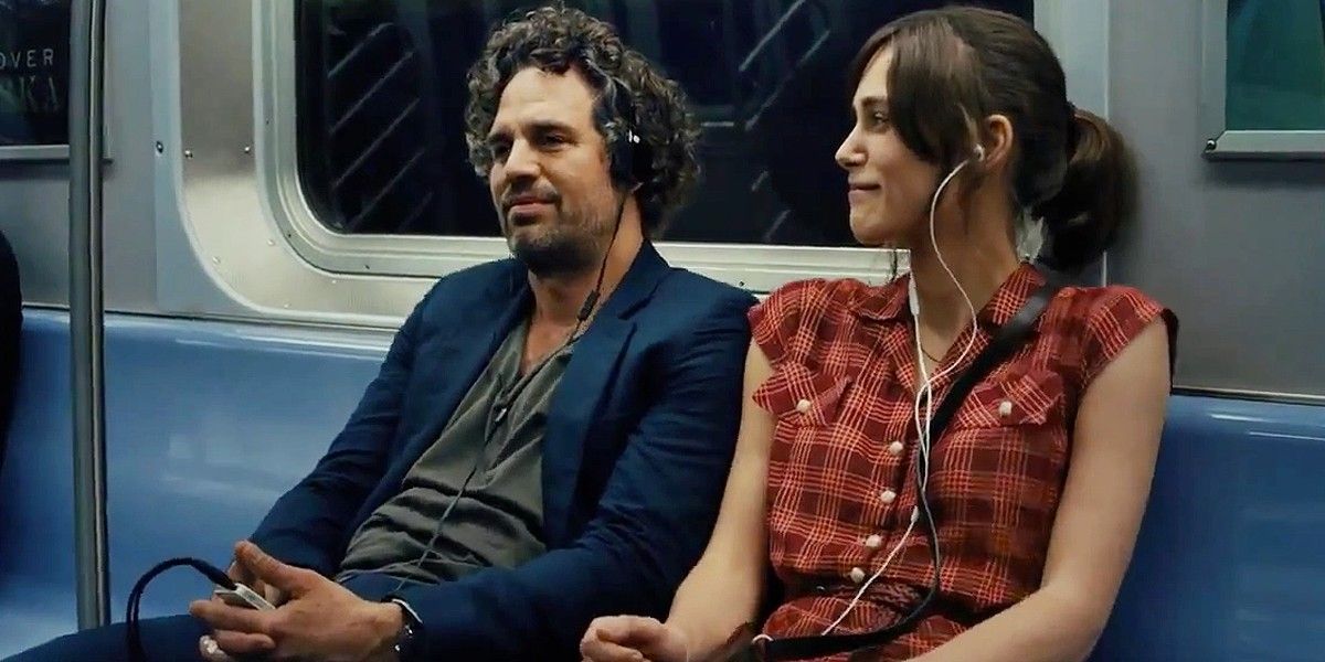 Mark Ruffalo and Kiera Knightley listening to music on the subway in Begin Again