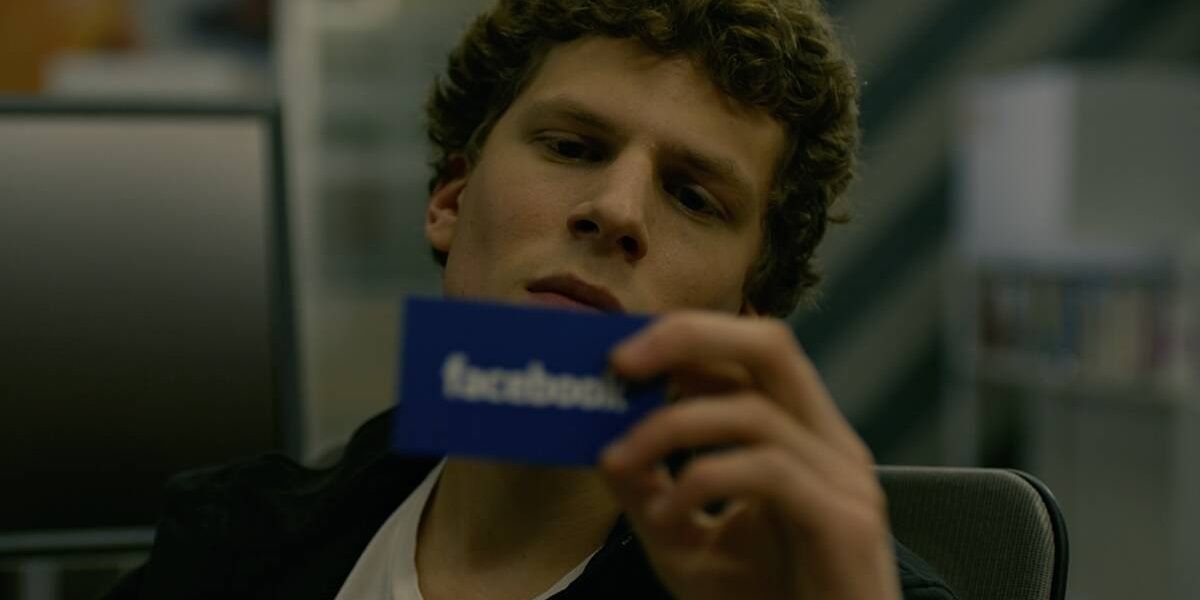 Mark Zuckerberg looking at a Facebook business card in The Social Network