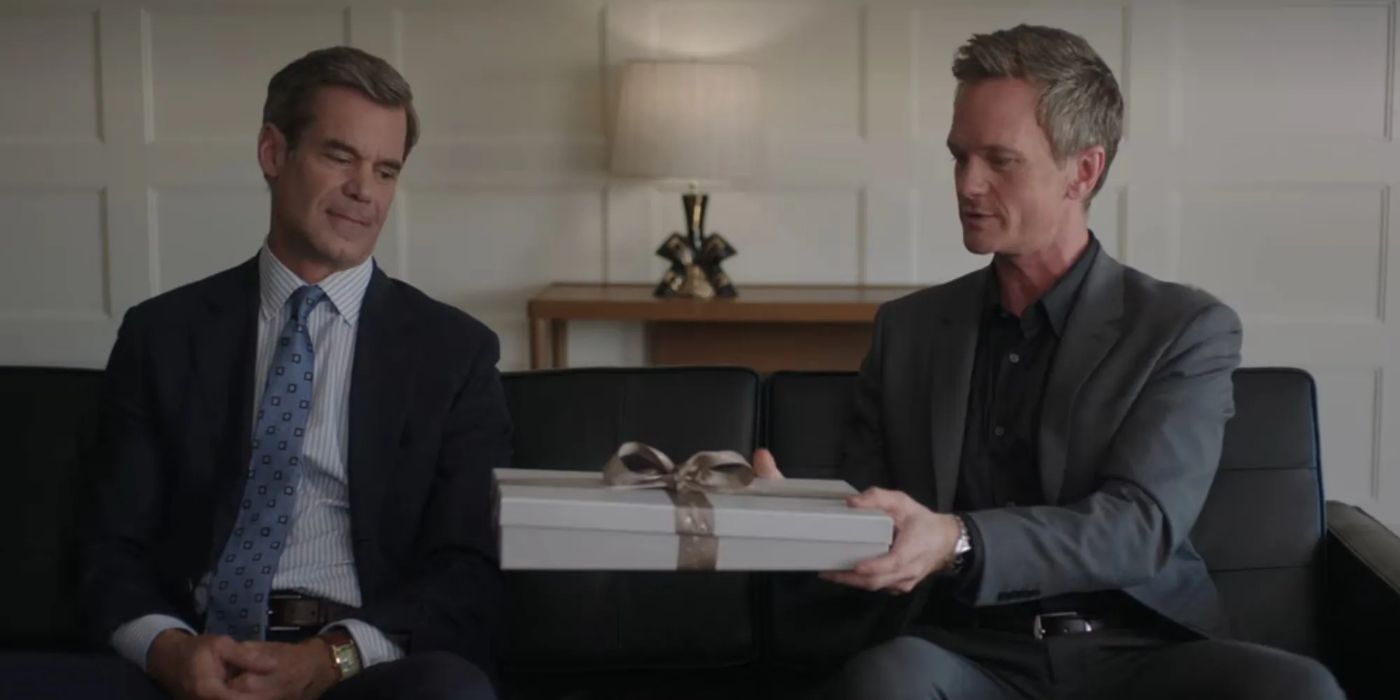 Michael gives Colin a gift in couples therapy in Uncoupled. 