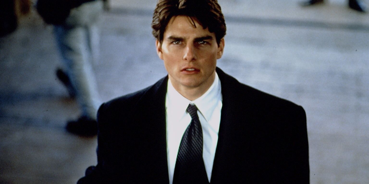 Mitch McDeere standing at the bottom of steps in The Firm