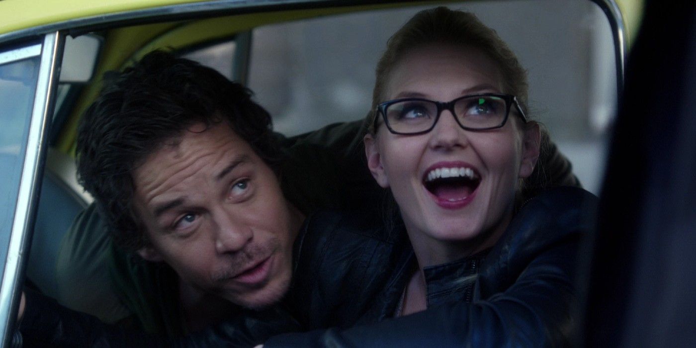 Emma and Neal playfully looking out the window in Once Upon A Time