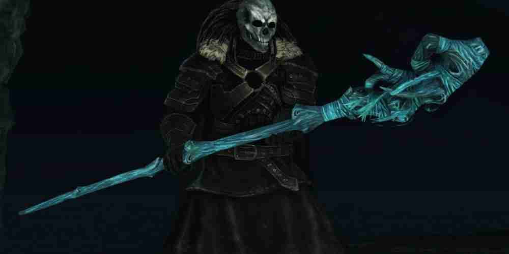 O cajado de Olenford azul brilha nas mãos de um personagem de 2 jogadores de Dark Souls.