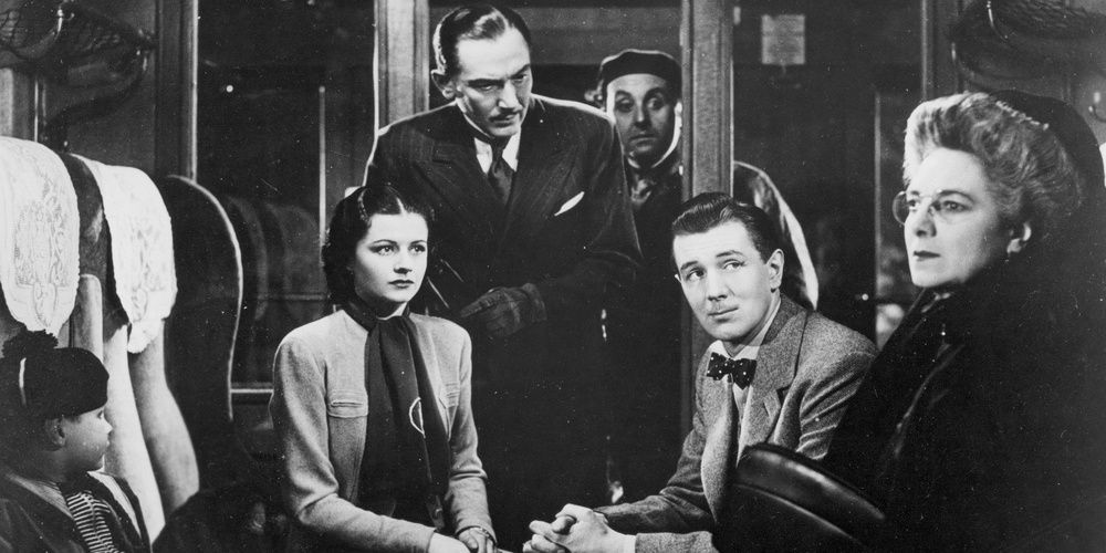 People in train compartment in The Lady Vanishes 