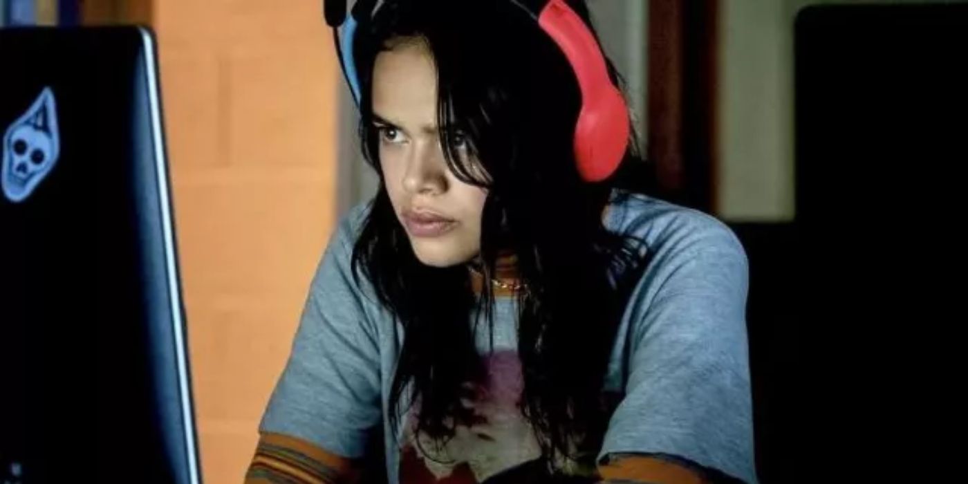 Mouse Horanda wearing headphones and staring at a computer on Pretty Little Liars: Original Sin