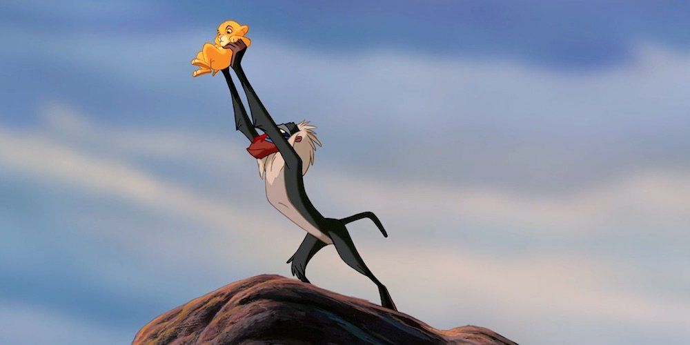 Rafiki holds Simba over Pride Rock