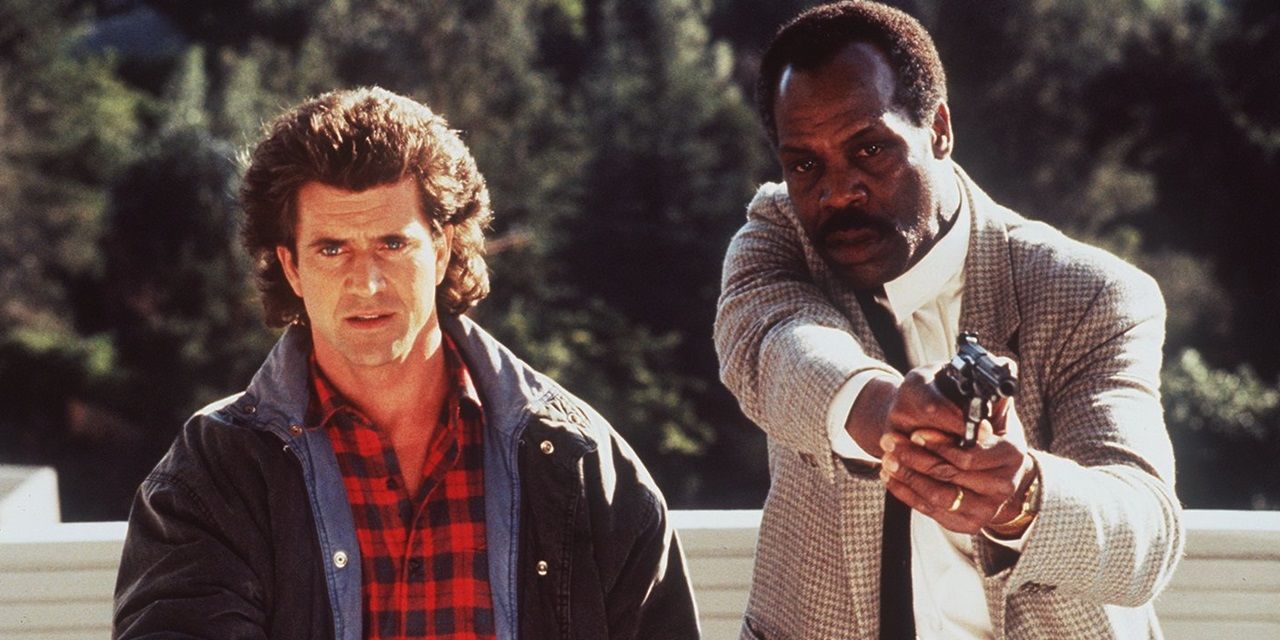 Riggs and Murtaugh with guns in Lethal Weapon