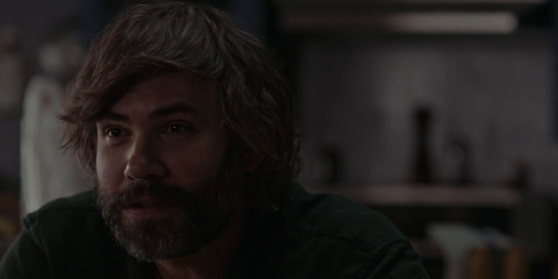 Rossif Sutherland sitting in a still from Possessor Cropped