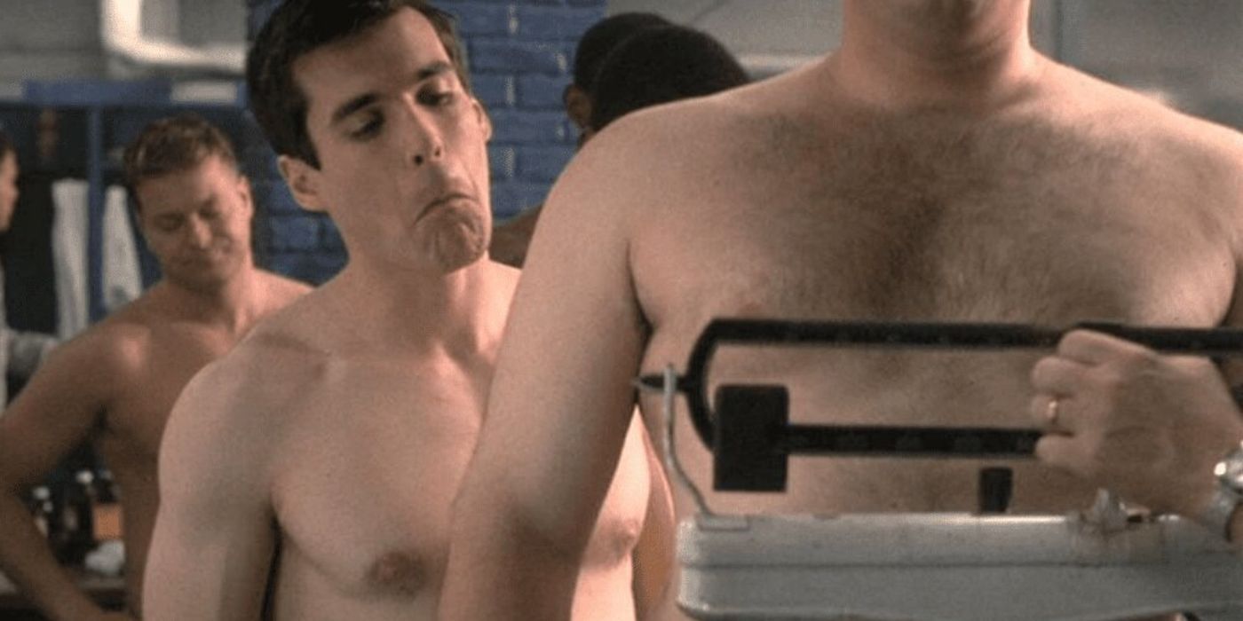 Sean Maher admires another man's physique