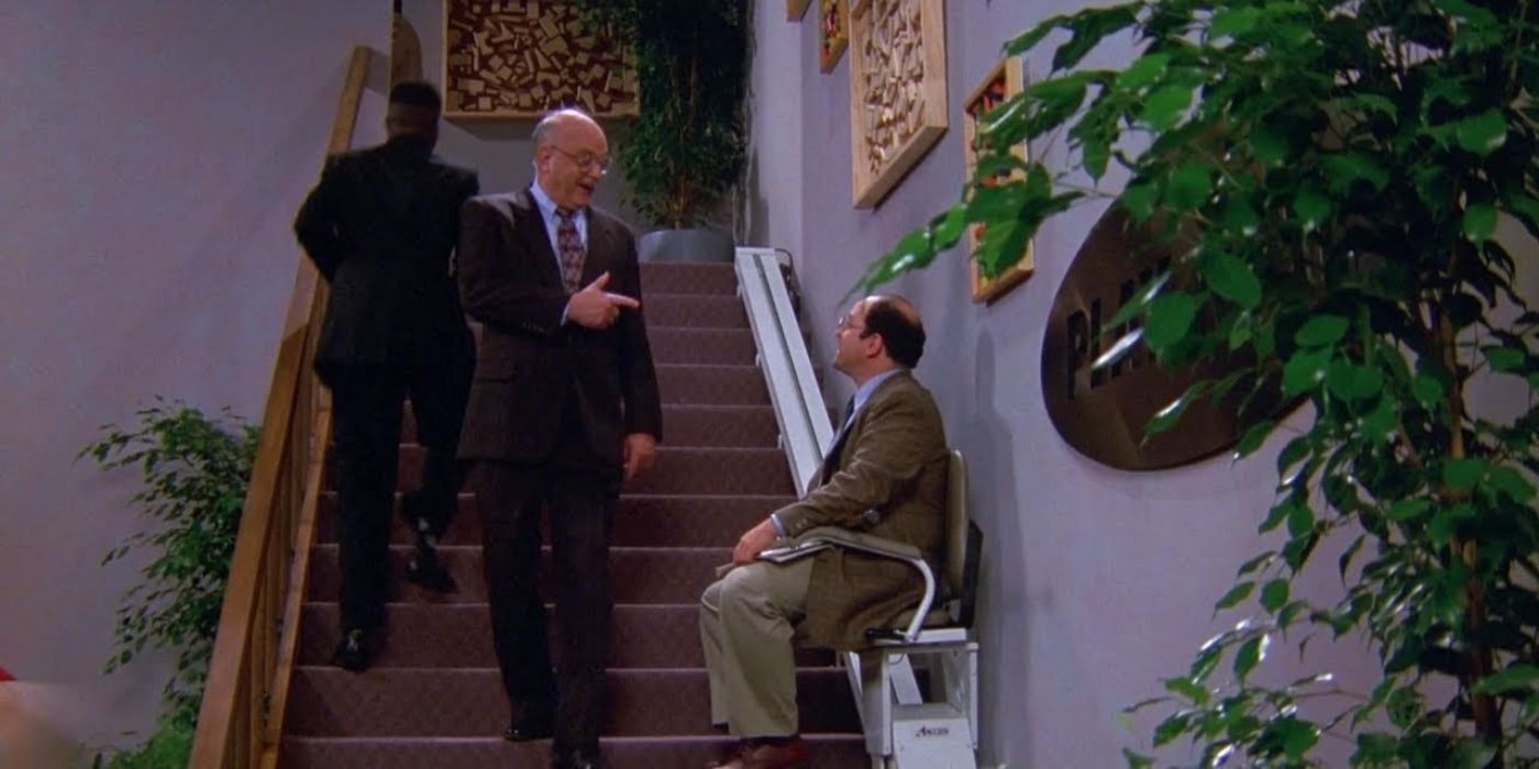 George sitting in a wheelchair on the stairs on Seinfeld