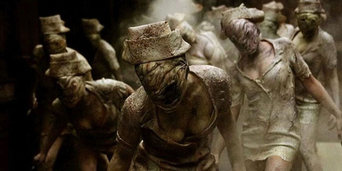 A group of nurses walk towards the camera in Silent Hill 