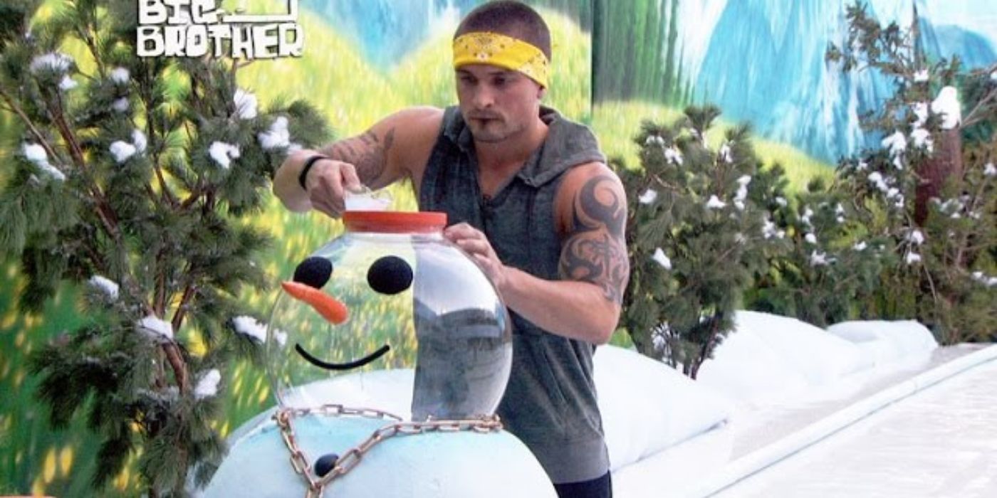 A male contestant with a snowman in Big Brother.