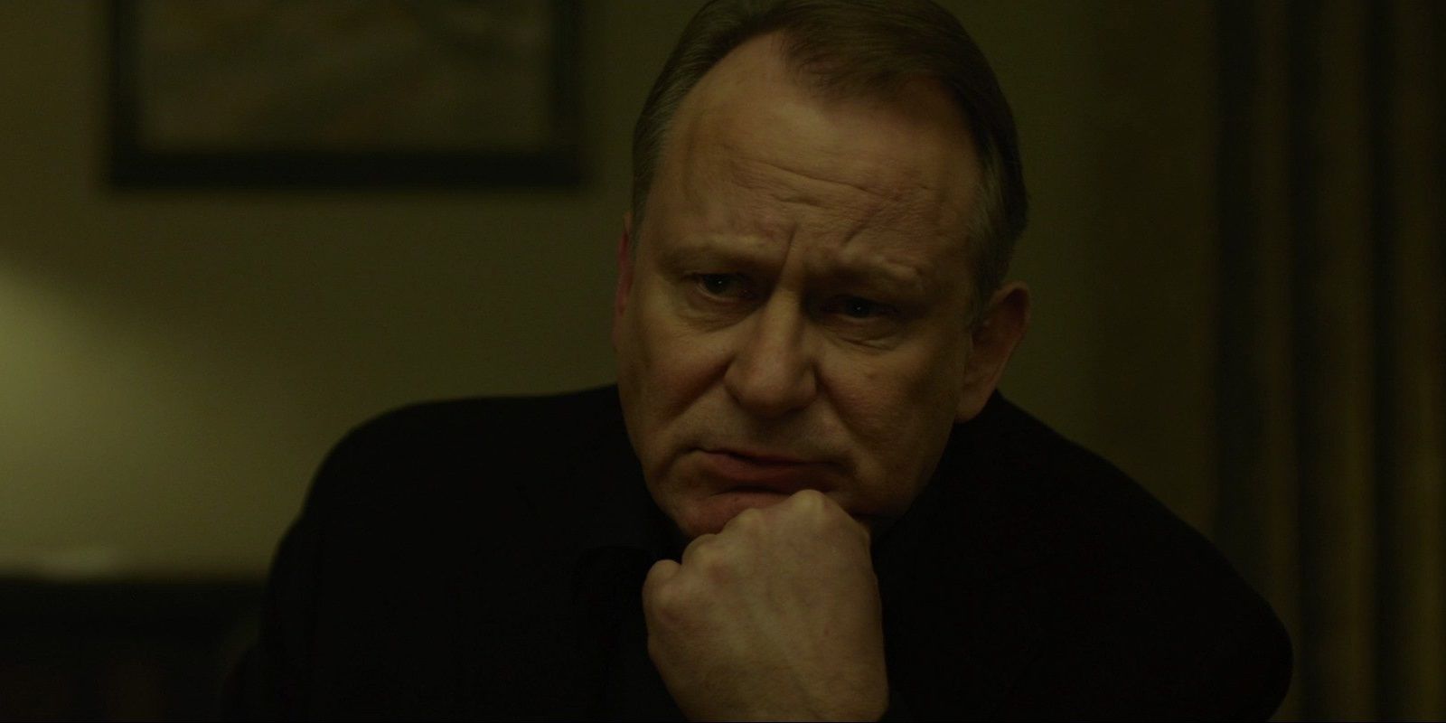 Stellan Skarsgard leaning on his hand in The Girl with the Dragon Tattoo