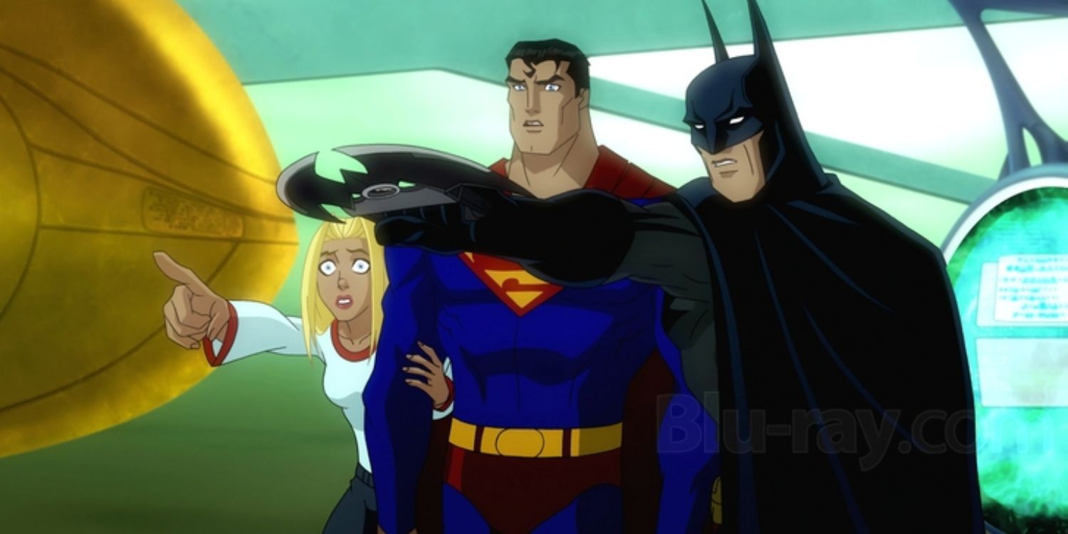 Batman showing Superman and Supergirl something on his computer