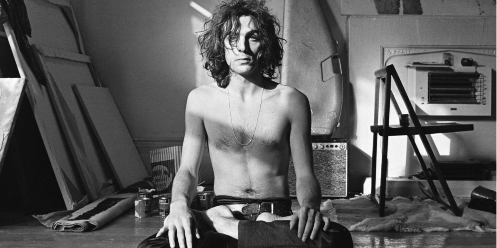 A shirtless Pink Floyd frontman