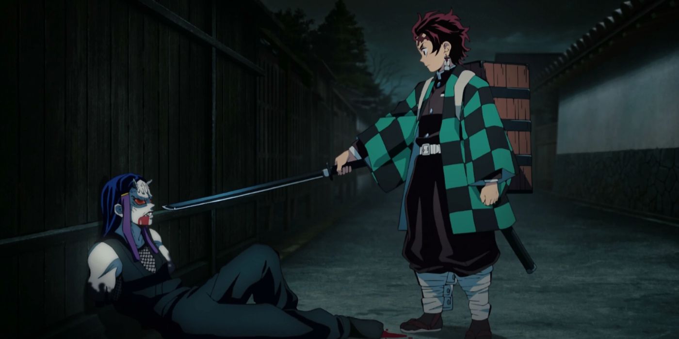 Tanjiro questioning the beaten Swamp Demon in Demon Slayer.
