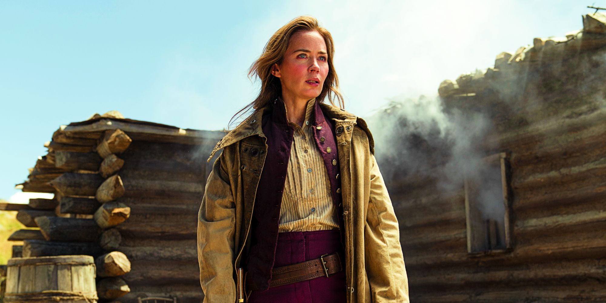 The English Emily Blunt as Lady Cornelia Locke standing in front of a cabin