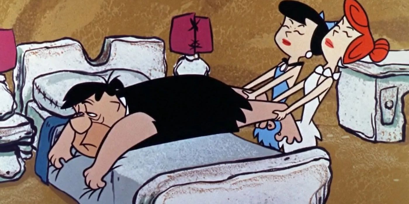The Flintstones: Wilma and Betty try to pull a lethargic Fred out of bed