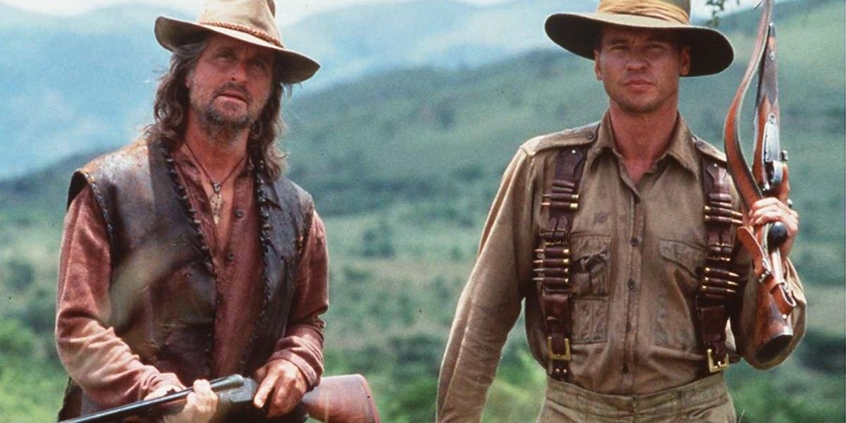 Michael Douglas and Val Kilmer holding rifles in The Ghost and the Darkness